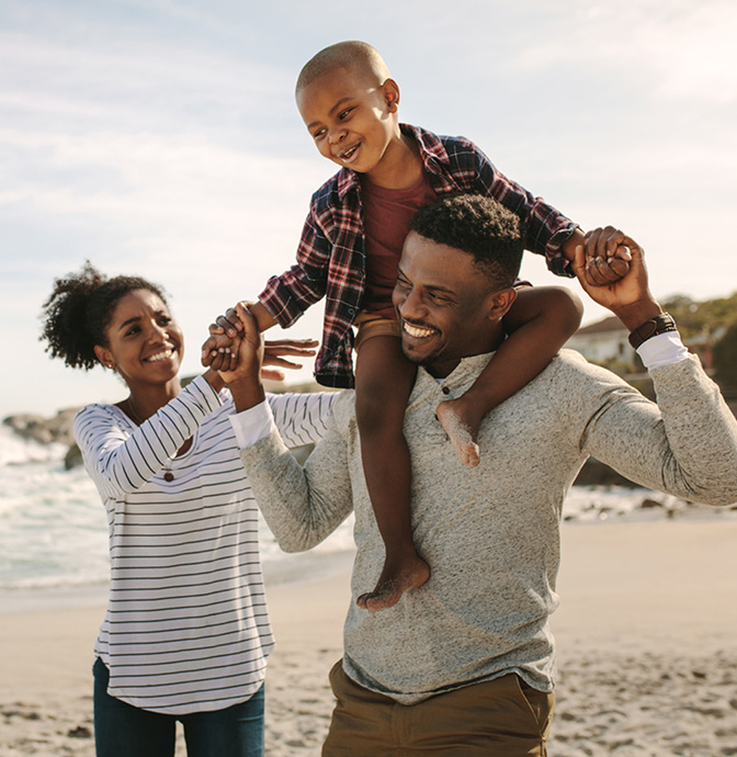 Family Having Fun On Beach